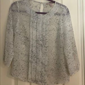 White and black speckled blouse